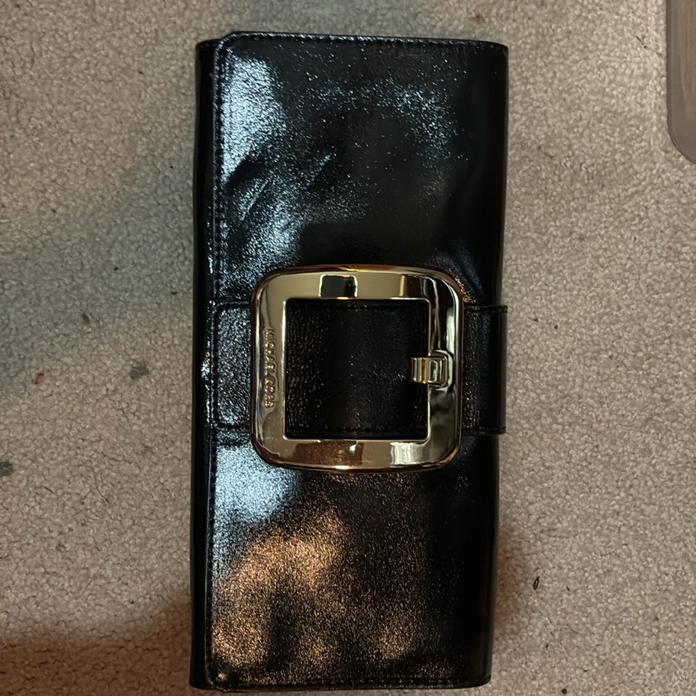 Brand New Michael Kors genuine leather clutch